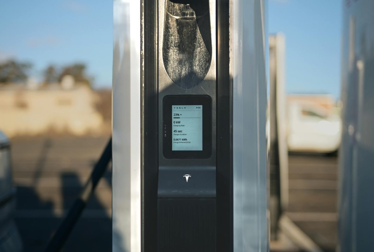 Vehicles lined up at a fast-charging corridor station.