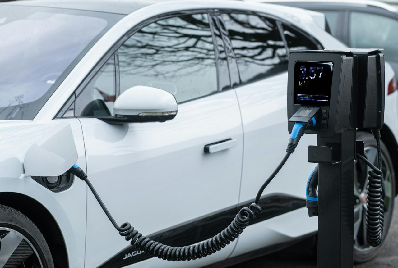 Vehicles lined up at a fast-charging corridor station.