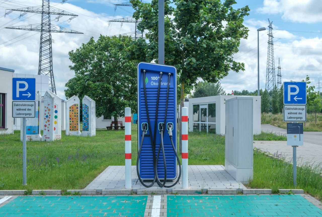 Vehicles lined up at a fast-charging corridor station.